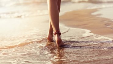 woman walks by the sea