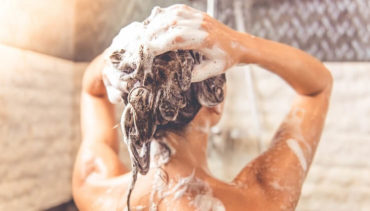 woman washes her hair