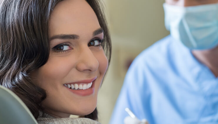 woman on the dentist smiling