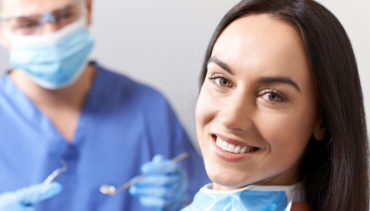 woman smiling in her dentist