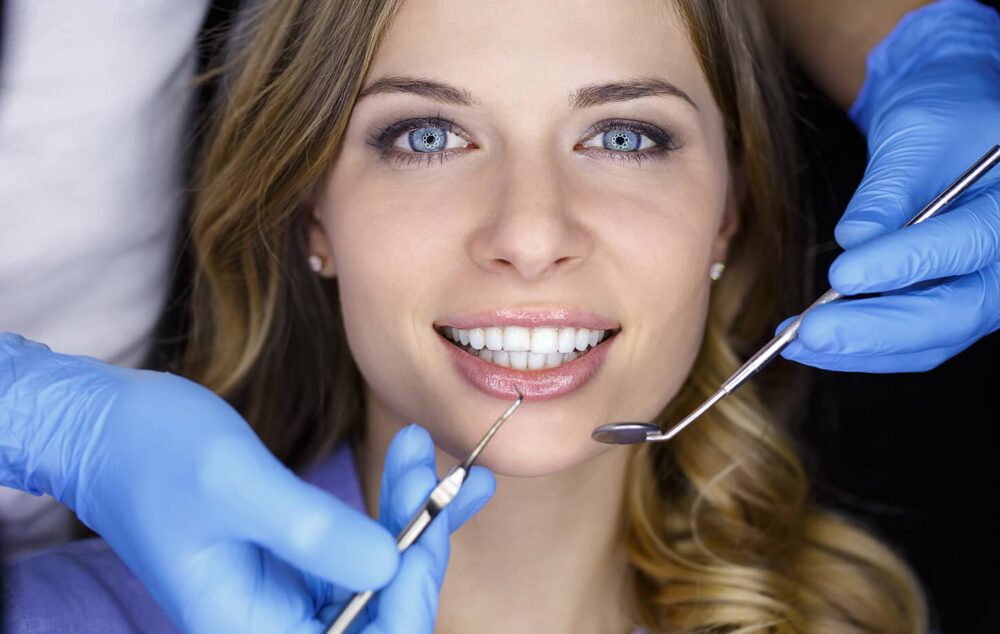 blue eyed woman on the dentist