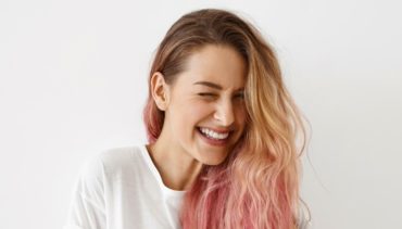 pink haired woman smiling