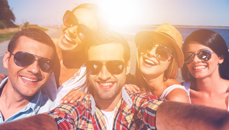 young people with sunglasses taking selfie