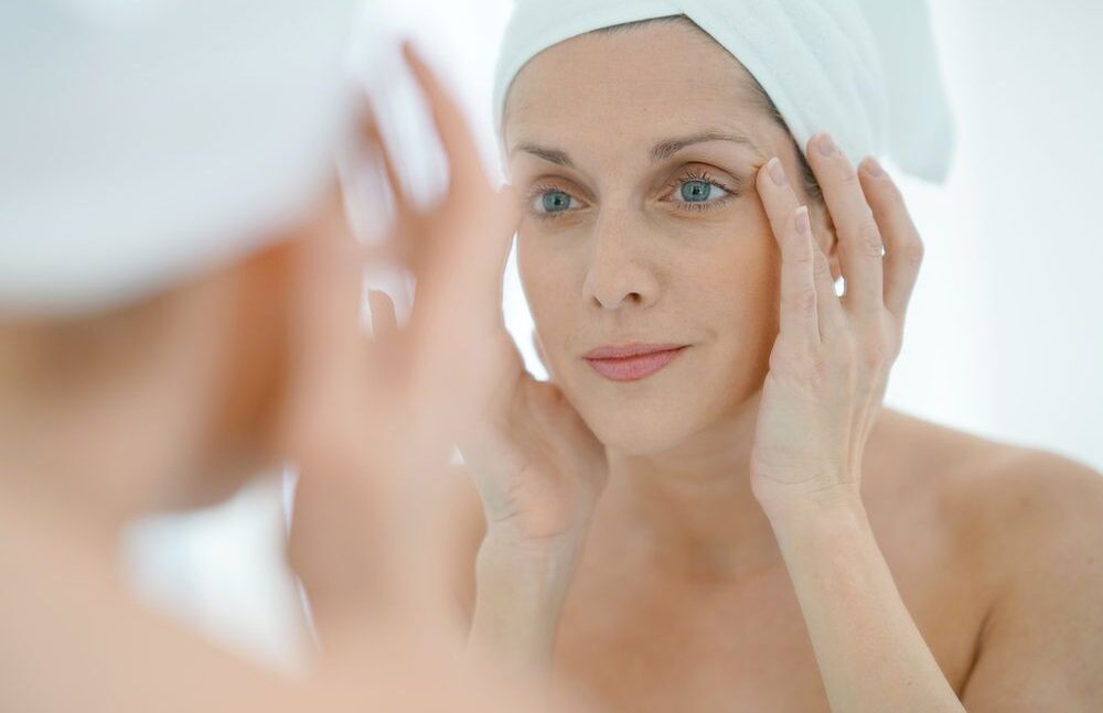 woman with blue eyes and towels after the bath
