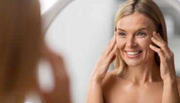 woman applying eye cream