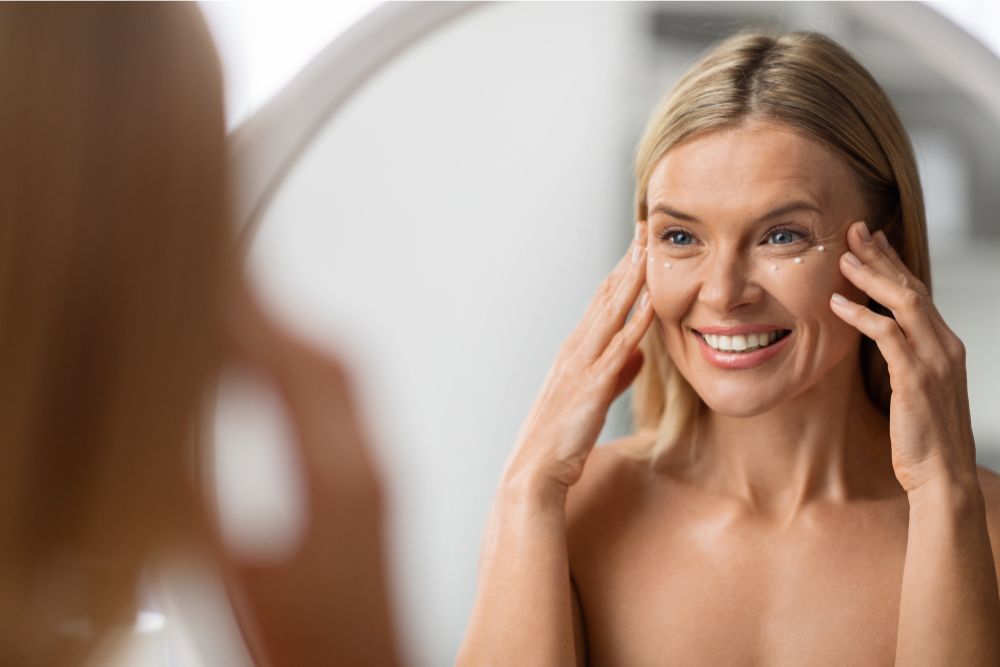 woman applying eye cream