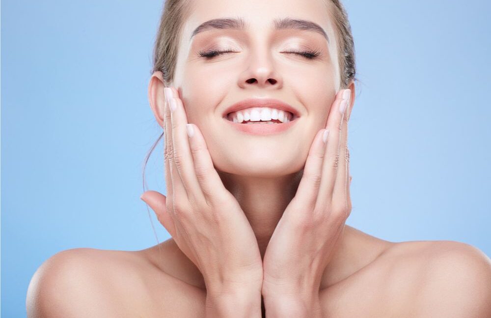 beautiful woman touching her face