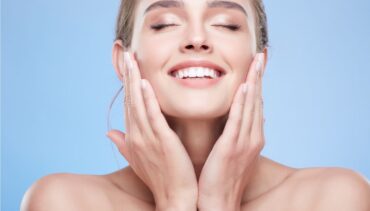 beautiful woman touching her face