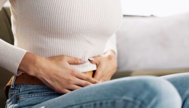 woman touching belly