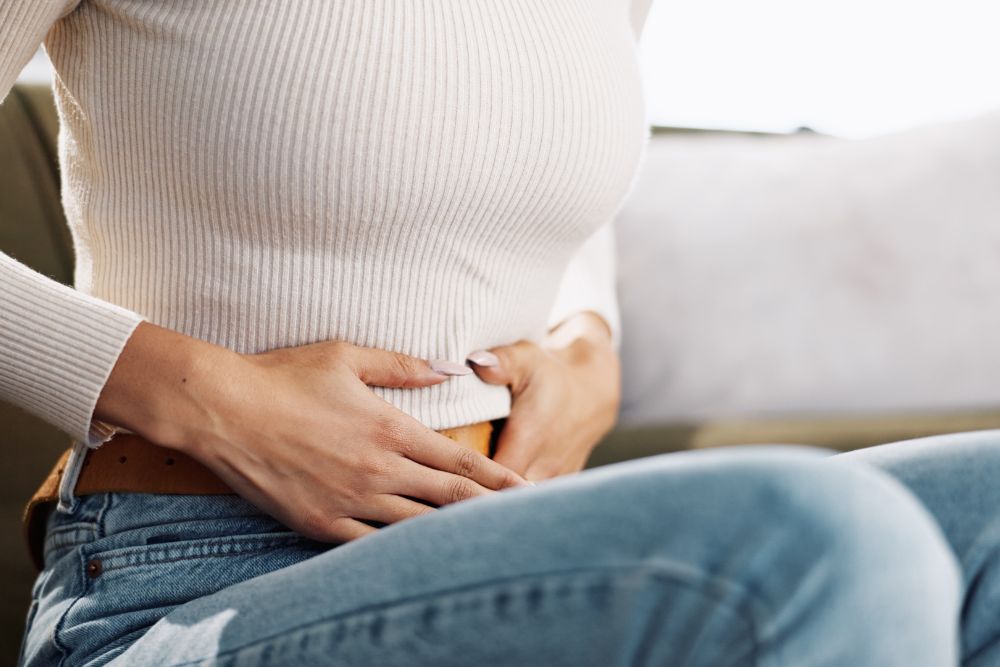 woman touching belly