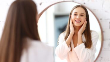 Woman applies cream