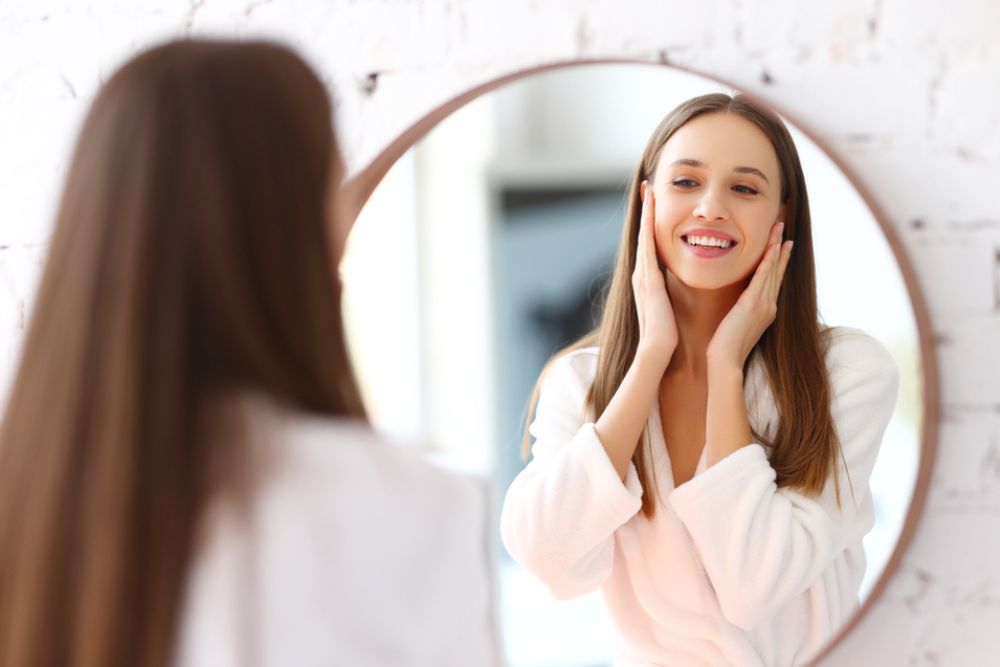 Woman applies cream